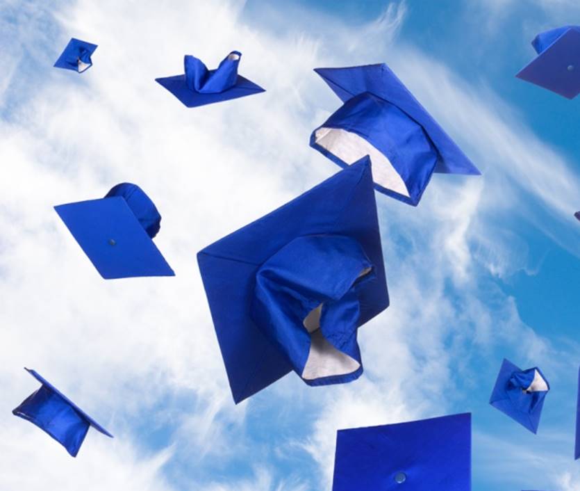 graduation caps tossed in air